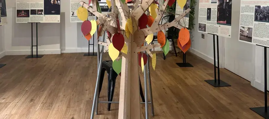 A home crafted tree with messages on the leaves