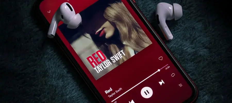 An ipod with a taylor swift album displayed on the screen
