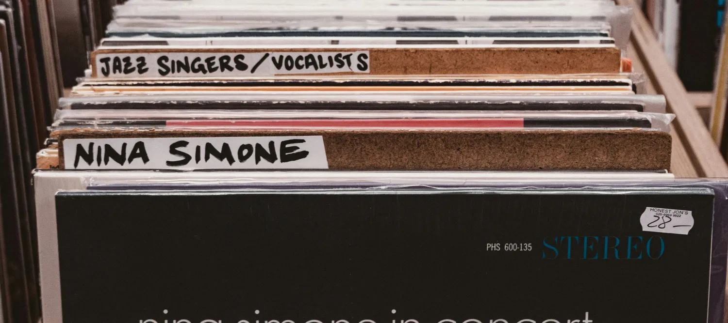 a selection of vinyl records in a record shop with Nina Simone at the front