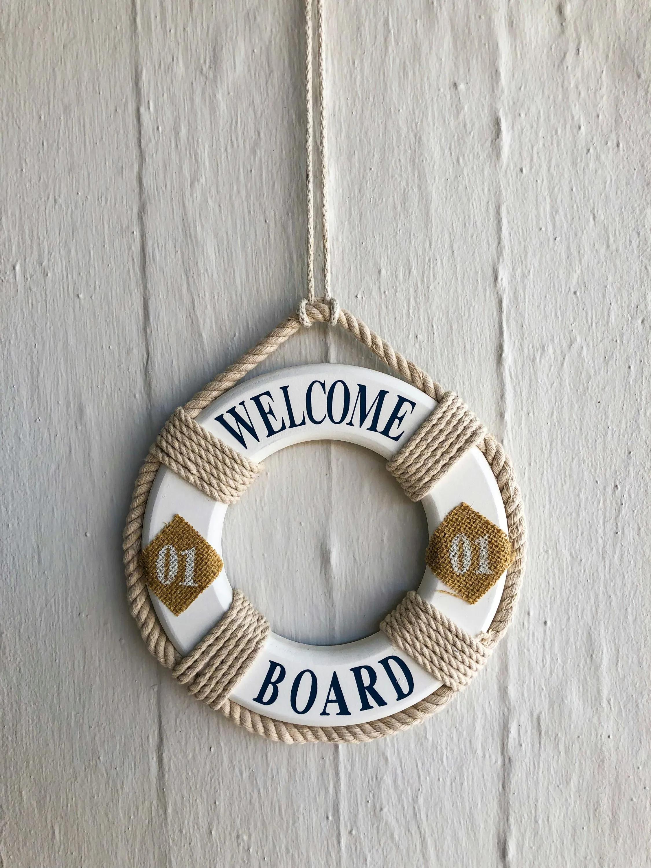 An ornamental life ring with welcome board written on it 