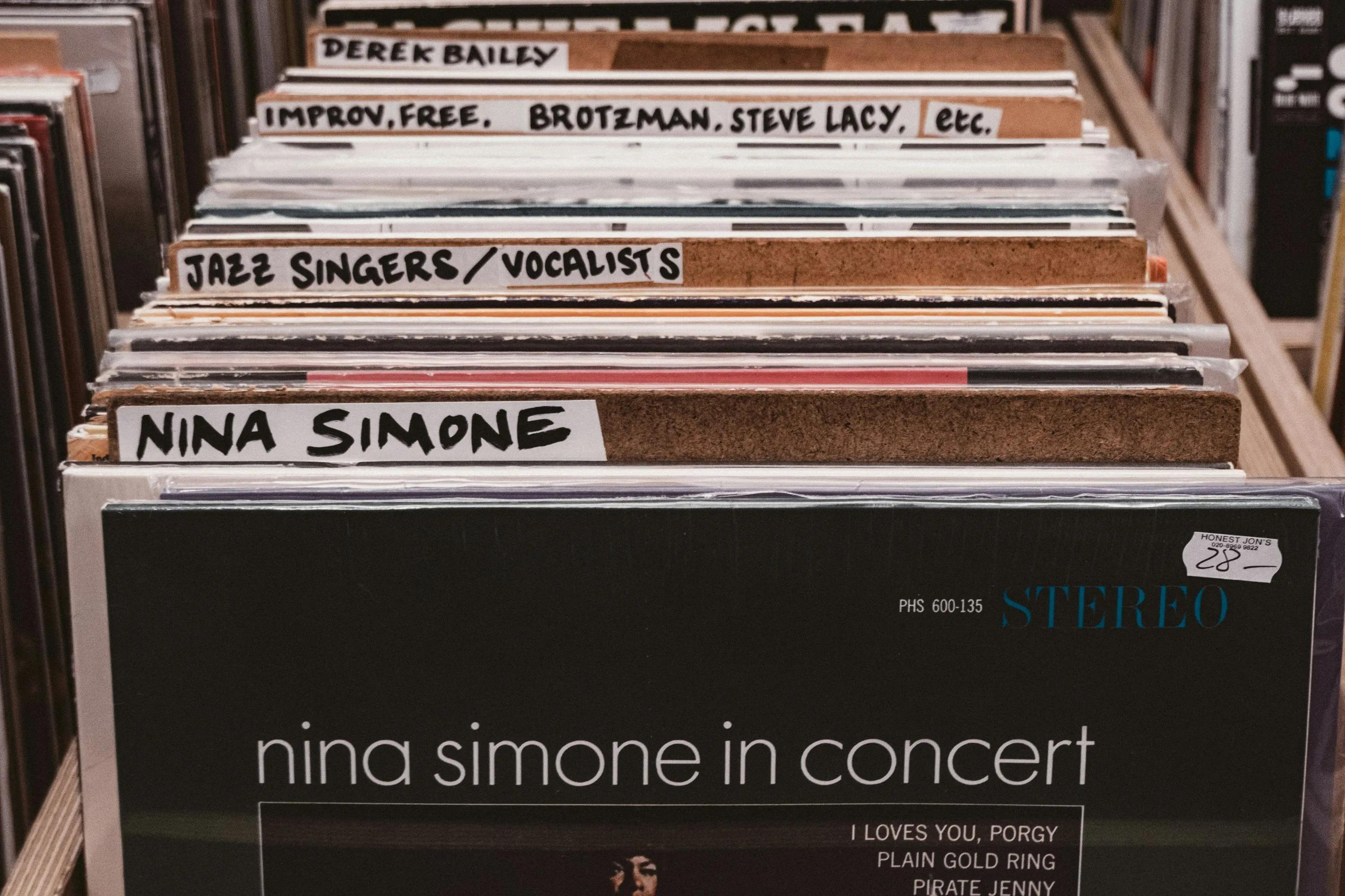 a selection of vinyl records in a record shop with Nina Simone at the front