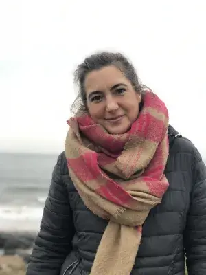 Katy standing on a beach