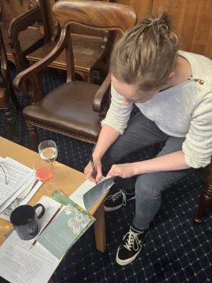 Kitty Signing her book