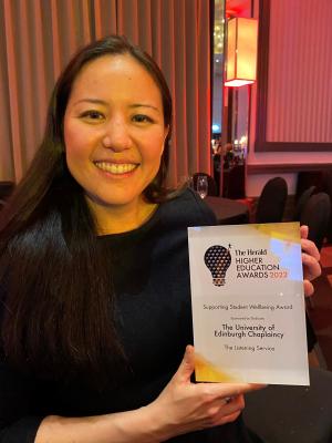 Lilian Lee holding an award