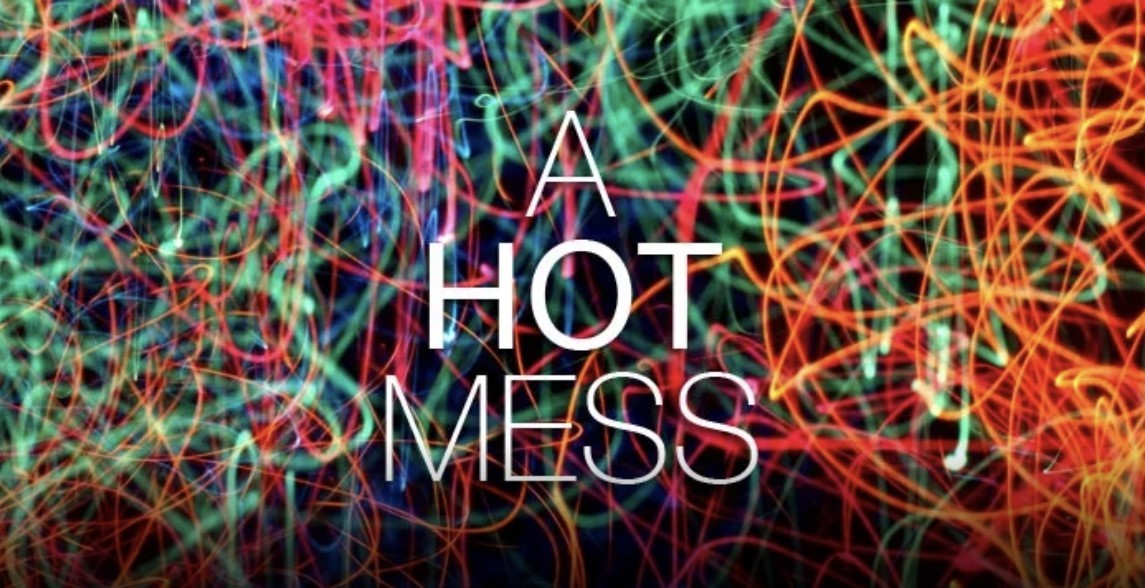 A picture showing the words \"a hot mess\" over a background of mixed blurry neon lights.