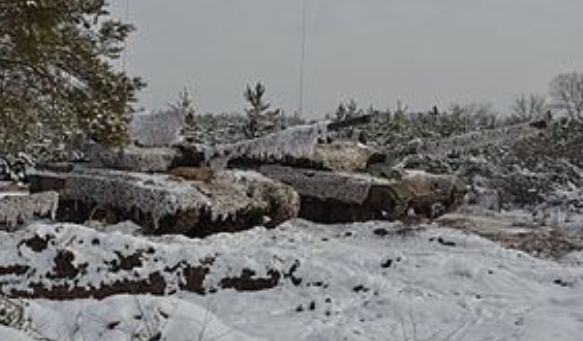 Photograph taken in Eastern Ukraine showing a tank covered in snow. 