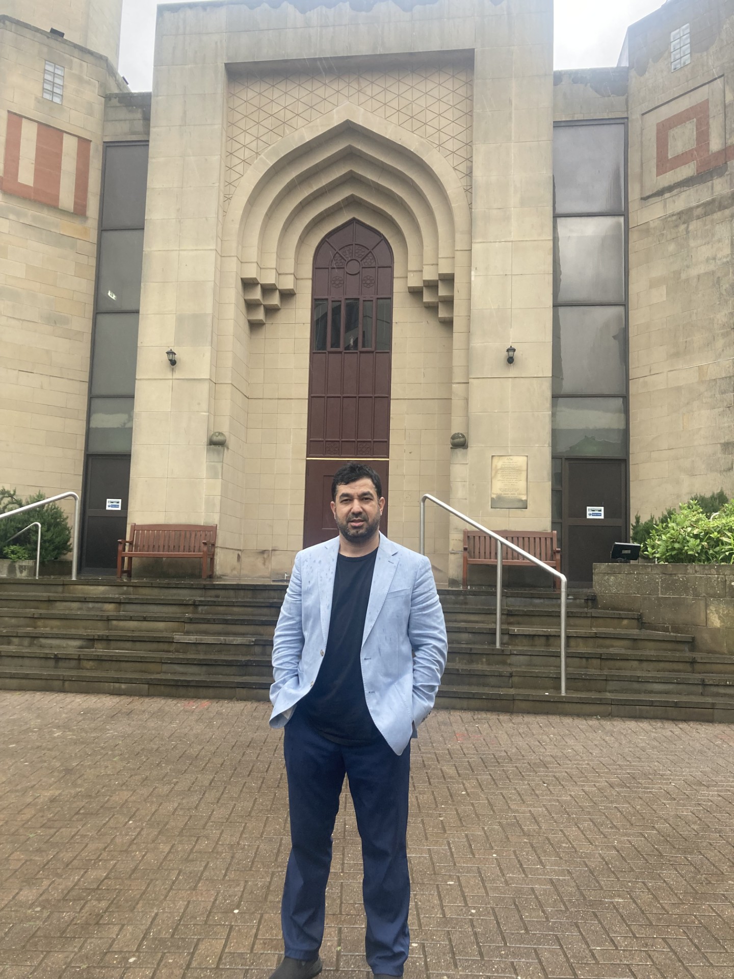 A photo of Fatih in front of a mosque 