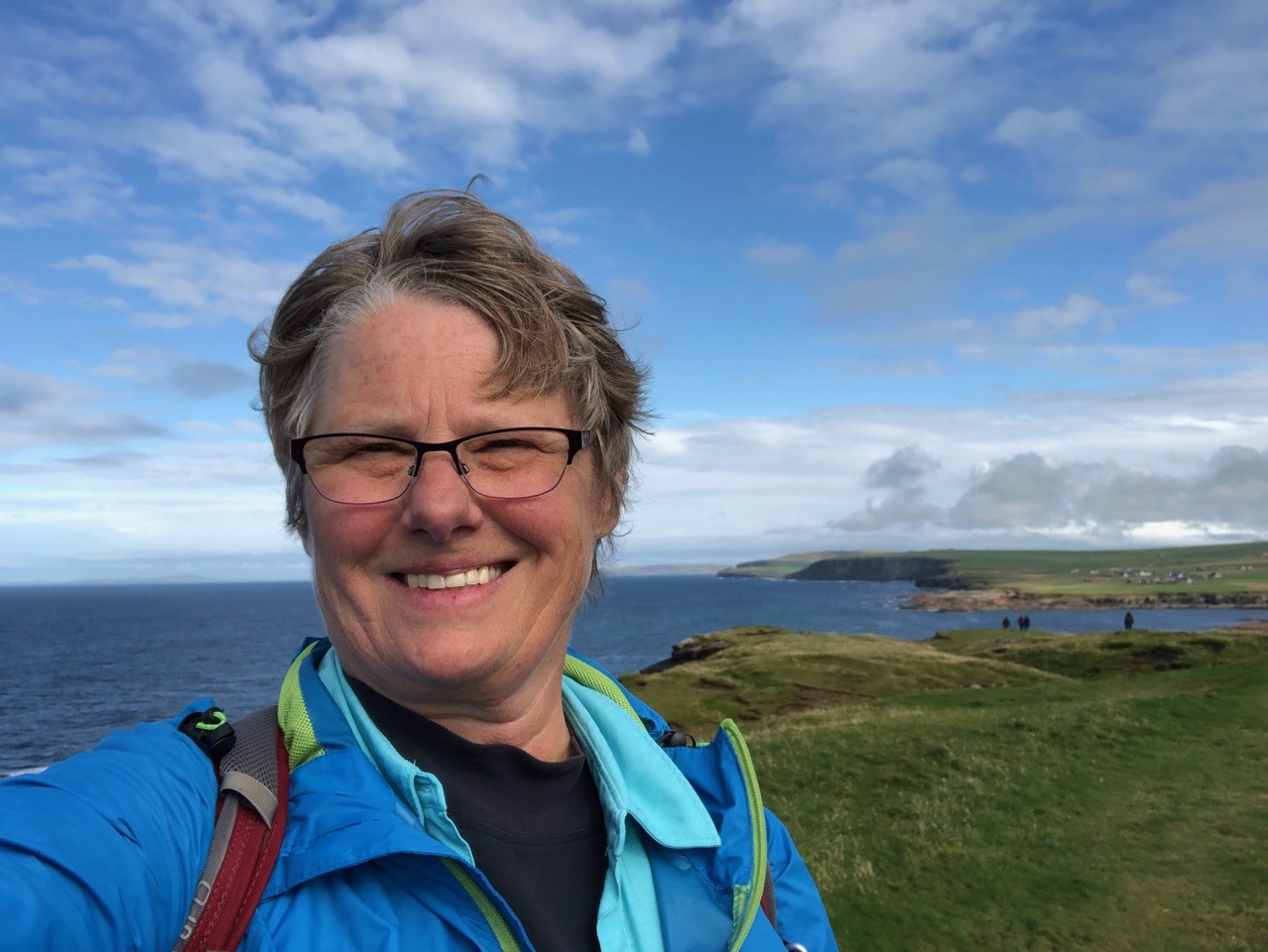 A photo of a Woman next to the Scottish shoreline